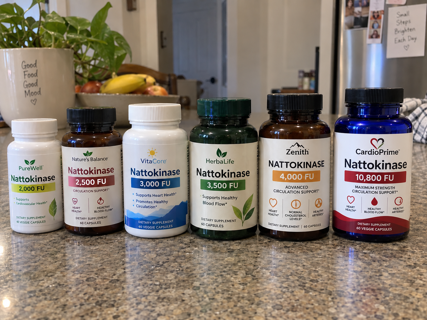 Six nattokinase supplement bottles lined up on a kitchen counter, each labelled with a different FU strength, ending with the blue 10,800 FU bottle.